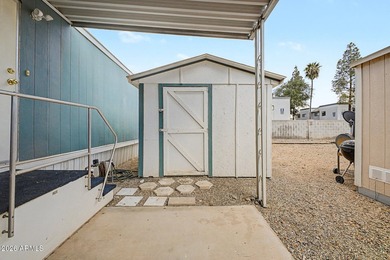 Welcome home! This charming 3-bedroom, 2-bath mobile home greets - photo 31