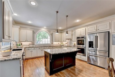 This beautifully updated brick traditional home is in the - photo 5