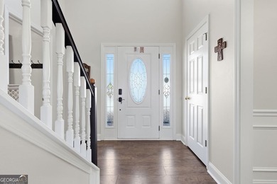 Beautiful brick front 4 bedroom, 4 full bathroom home featuring