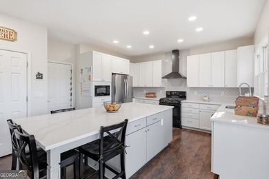 Beautiful brick front 4 bedroom, 4 full bathroom home featuring