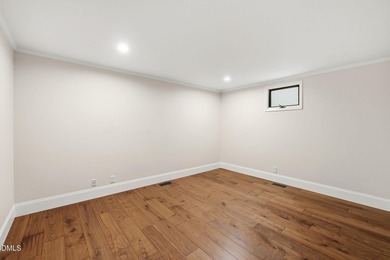 Tucked away on 5 private wooded acres with a peaceful pond, this - photo 11