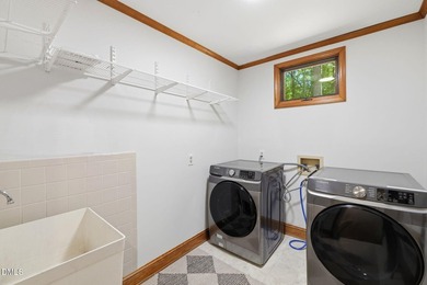 Tucked away on 5 private wooded acres with a peaceful pond, this - photo 13