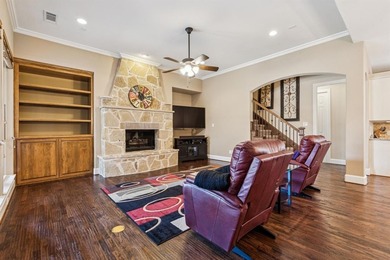 Step into luxury with this pristine custom Highland home