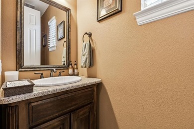 Step into luxury with this pristine custom Highland home