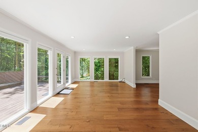 Tucked away on 5 private wooded acres with a peaceful pond, this - photo 17