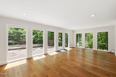 Tucked away on 5 private wooded acres with a peaceful pond, this - photo 18