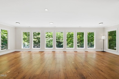 Tucked away on 5 private wooded acres with a peaceful pond, this - photo 21