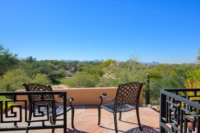 Perched atop a scenic hill in the prestigious Oro Valley Heights