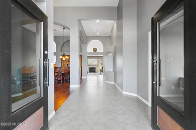 Perched atop a scenic hill in the prestigious Oro Valley Heights