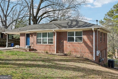 Welcome home to this fully renovated 4-sided brick ranch located - photo 4