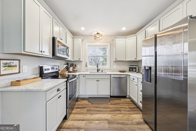 Welcome home to this fully renovated 4-sided brick ranch located - photo 10