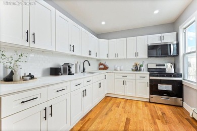 JUST LISTED MOVE-IN READY SUNNY SOUTH-FACING 2-FAMILY TOWNHOUSE - photo 9