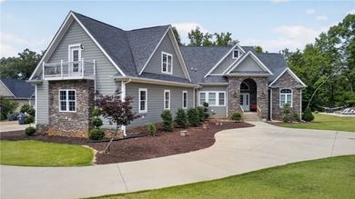 Custom, custom, custom - this extraordinary lakefront retreat is - photo 1