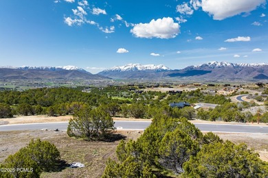 Positioned in a premier location within Red Ledges, Lot 911 is - photo 3