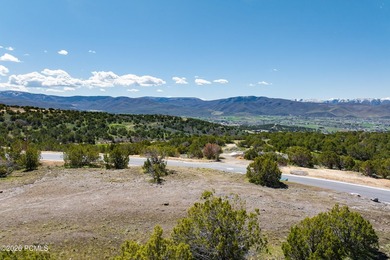 Positioned in a premier location within Red Ledges, Lot 911 is - photo 4