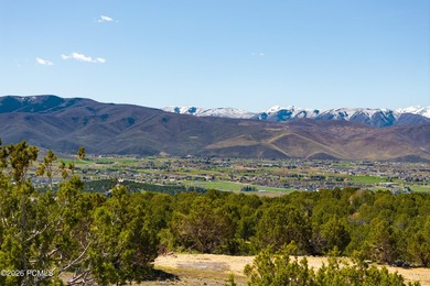 Positioned in a premier location within Red Ledges, Lot 911 is - photo 6