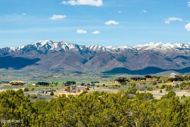 Positioned in a premier location within Red Ledges, Lot 911 is - photo 7