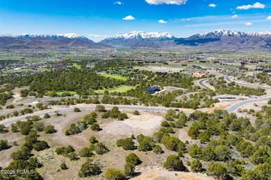 Positioned in a premier location within Red Ledges, Lot 911 is - photo 8