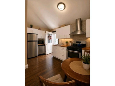 This home is COMPLETELY RENOVATED and FULLY DETACHED on an - photo 8