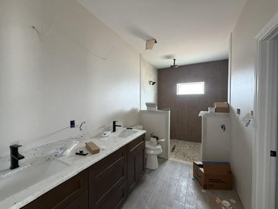 Another stunning creation by Deluxe Custom Homes! This 4-bedroom - photo 11