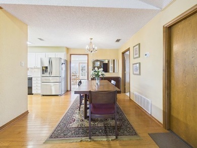 Tucked beneath a canopy of mature trees in the heart of