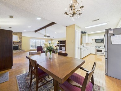 Tucked beneath a canopy of mature trees in the heart of