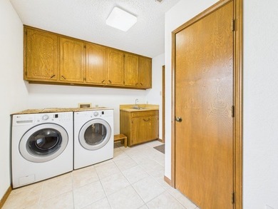 Tucked beneath a canopy of mature trees in the heart of