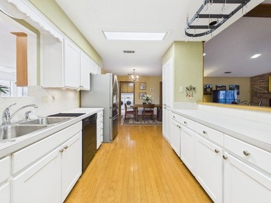 Tucked beneath a canopy of mature trees in the heart of