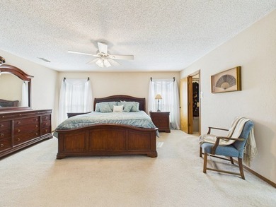 Tucked beneath a canopy of mature trees in the heart of