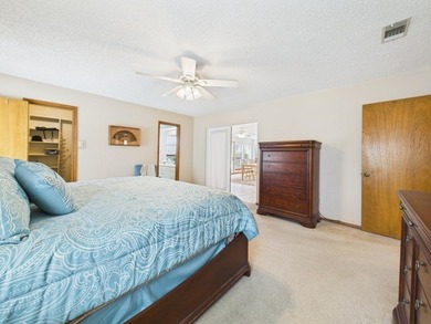 Tucked beneath a canopy of mature trees in the heart of