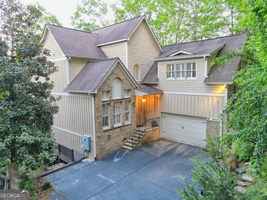Nestled in the coveted Waterfall at Lake Burton community, this - photo 4