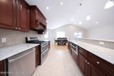 Stunning Two Family Semi-Attached home conveniently located to - photo 8