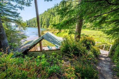 Tucked away in the trees on beautiful Woahink Lake, this rare 1 - photo 19