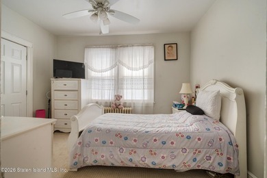 Welcome to this charming two-family home ideally located in - photo 8