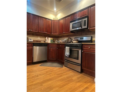 Welcome to this spacious and well-maintained condo located in - photo 4