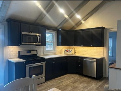 Tucked away on a private .72-acre flag lot, this cozy 2-bedroom - photo 4