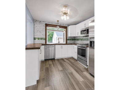 Discover Your Dream Home in Amityville!  Step into this stunning - photo 13