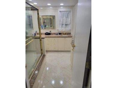 Discover Your Dream Home in Amityville!  Step into this stunning - photo 19