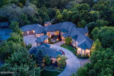 Tucked away on a private, tree-lined lane in Holladay, this - photo 1