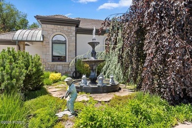 Tucked away on a private, tree-lined lane in Holladay, this - photo 3