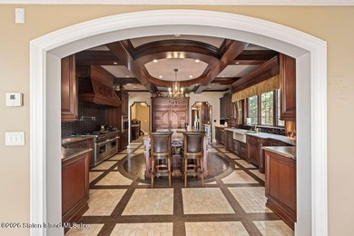 Beyond a private gated entrance and sweeping drive, this - photo 9
