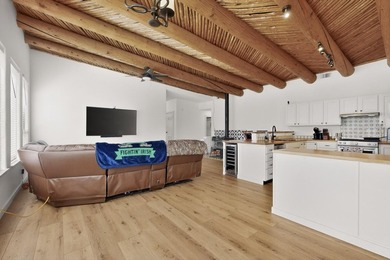 Explore this custom pueblo home with an open floor plan! Light - photo 3