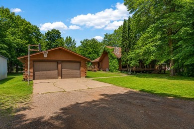 Nestled in the woods on 1.2 acres, this charming partial log - photo 1