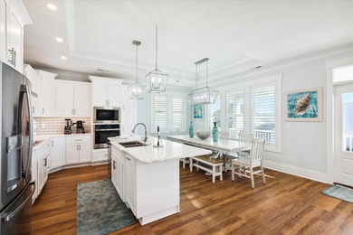 Welcome to this 5 bedroom, 5 and one half bath dream beachside