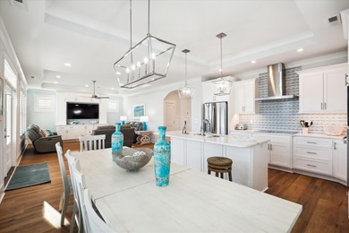 Welcome to this 5 bedroom, 5 and one half bath dream beachside