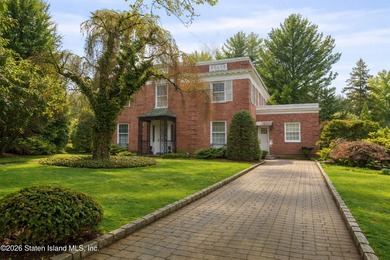 Nestled in prestigious Grymes Hill, this timeless residence is - photo 1