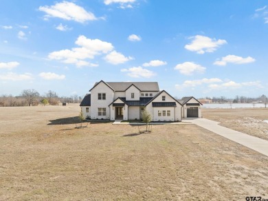 Welcome to your dream home in the prestigious lakefront - Lake Home For Sale in Mount Pleasant, Texas