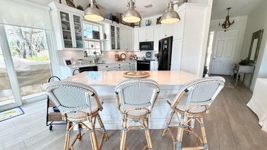 This stunningly renovated home offers modern luxury and peace of - photo 10