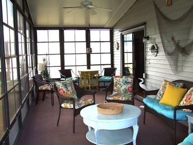 LARGE GREEN SPACE FACING THE WATER FROM A LARGE FLORIDA ROOM - photo 11