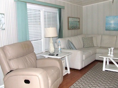 LARGE GREEN SPACE FACING THE WATER FROM A LARGE FLORIDA ROOM - photo 12